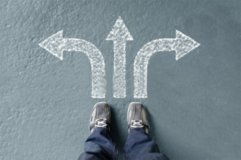 stock-photo-taking-decisions-for-the-future-man-standing-with-three-direction-arrow-choices-left-right-or-416963170拷貝